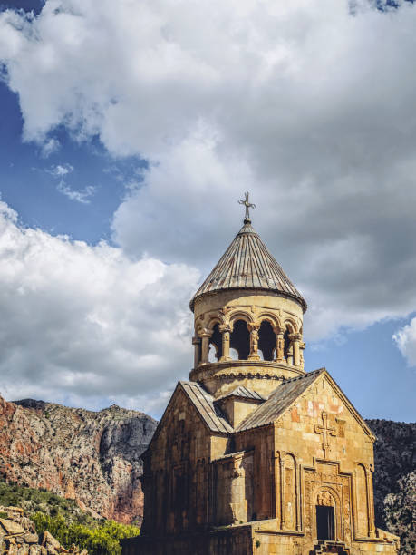 istock church tower in front of mountains and clouds 1001534090