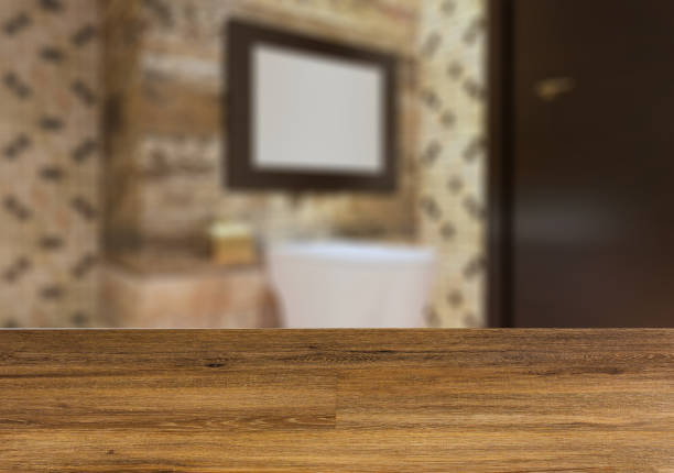 istock Clean and fresh bathroom with natural light.  The wooden table. Blurred interior. 1001553364