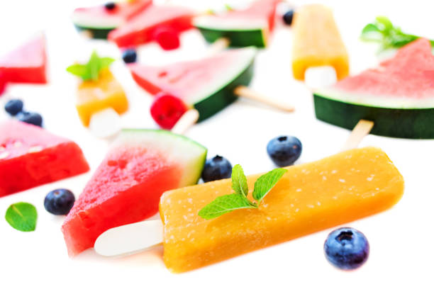 istock Summer patterm - Watermelon slice popsicle, fruit  ice-cream and berries on white background. Flat lay, top view.