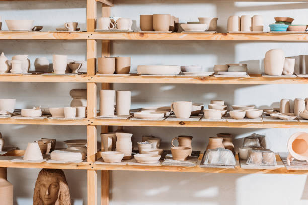 istock different ceramic dishware on wooden shelves in pottery workshop 1001567272
