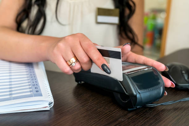 istock Administrator making payment with credit card and terminal 1001567882