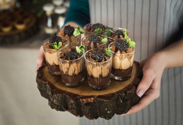 istock Chef holding wooden tray with chocolate dessert 1001568222