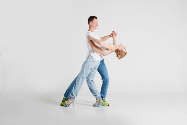 istock beauty couple dancing on a white background 1001571564