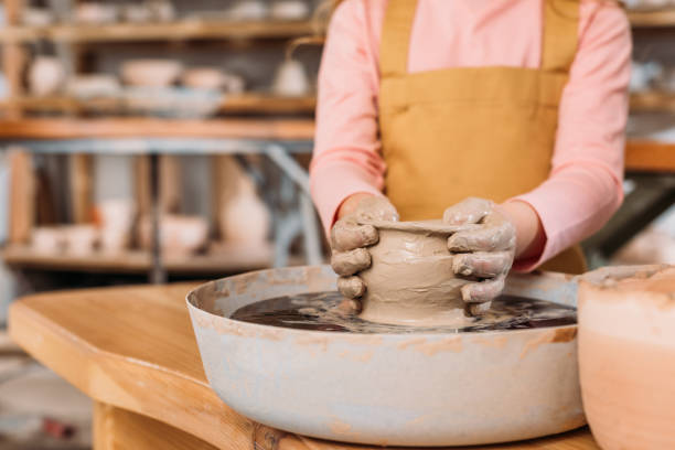 istock partial view of child making ceramic pot on pottery wheel in workshop 1001571892