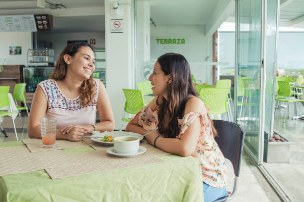 istock Two Young Women Friends At A Cafe 1001574928