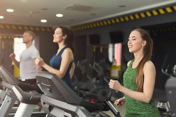 istock Fitness people training in gym on treadmills 1001576234