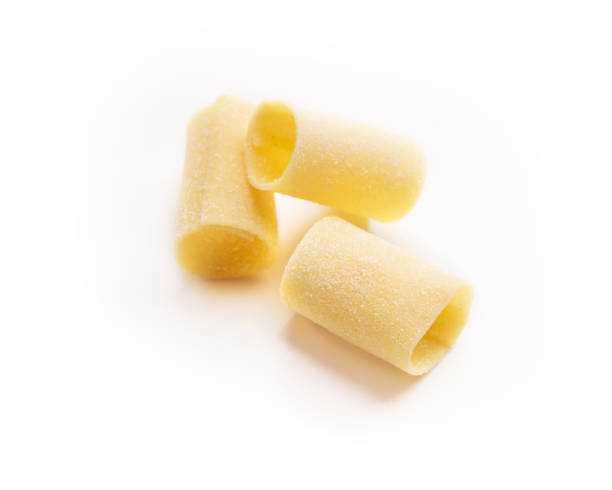 istock Pile of raw paccheri on white background 1001579616