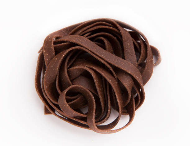 istock Raw unprepared chocolate pasta noodles isolated 1001579788
