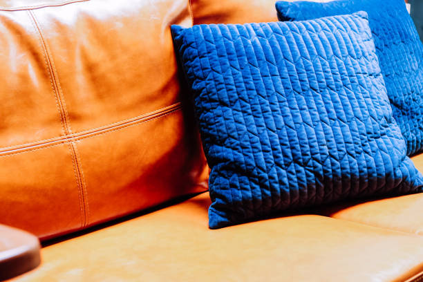 istock Close up detail of blue pillow on leather sofa 1001583486