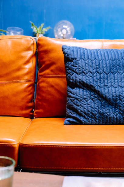 istock Close up detail of blue pillow on leather sofa 1001583664