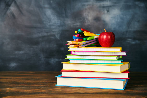 istock Back to school supplies against weathered chalkboard 1001583982