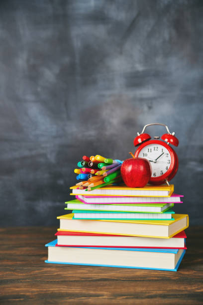 istock Back to school supplies against weathered chalkboard 1001584026