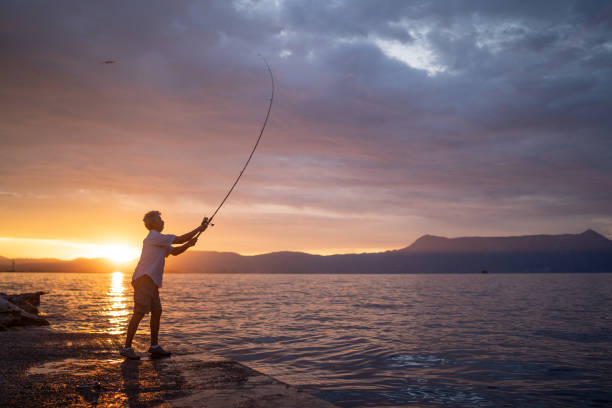 istock Retired senior man fishing 1001596084