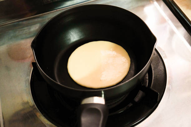 istock Making pancakes on frying pan , top view 1001596964