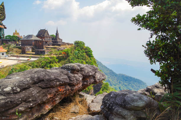 Buddhist temple Wat Sampov Pram and view on bottom of mountain Bokor and coast of gulf of Siam - a coastal line of Kampot. Cambodia, Preah Monivong Bokor National Park Kampot Province, southern Cambodia high temple stock pictures, royalty-free photos & images