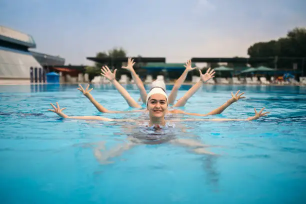 Girls practicing synchronised swimming