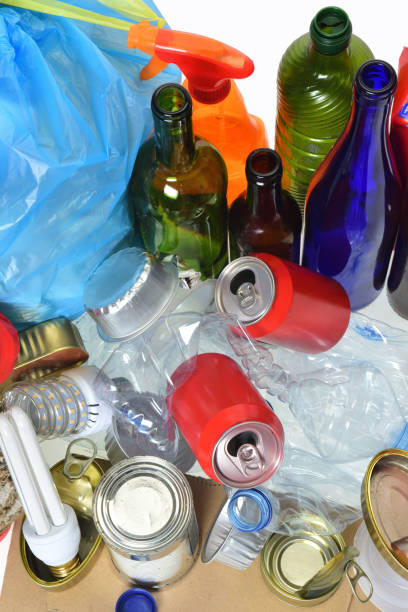 istock trash for recycling with paper glass bottles, cans, plastic bottle, light bulb 1001603428