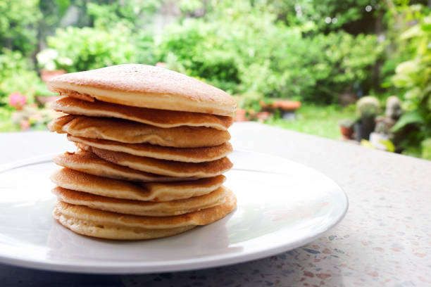 istock Stack of delicious pancakes on plate on the table 1001604108