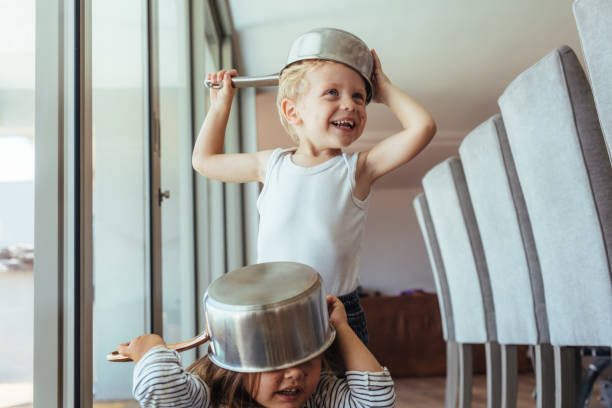 istock Children playing knight with kitchen utensil 1001604232