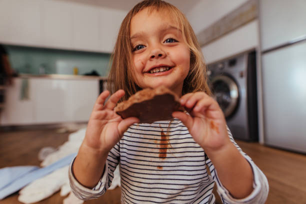 istock Girl eating her favorite chocolate 1001604314