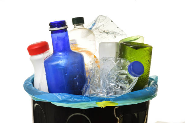istock garbage bin full of bottles to recycle on white 1001608208
