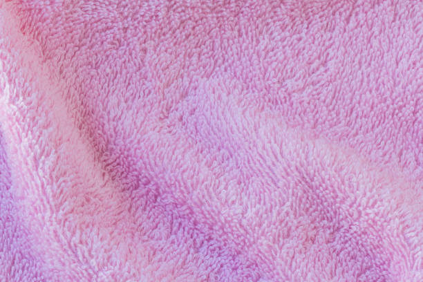 istock pink cotton towel background and texture 1001608360