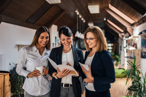 istock Three business women in coworking office. 1001611640