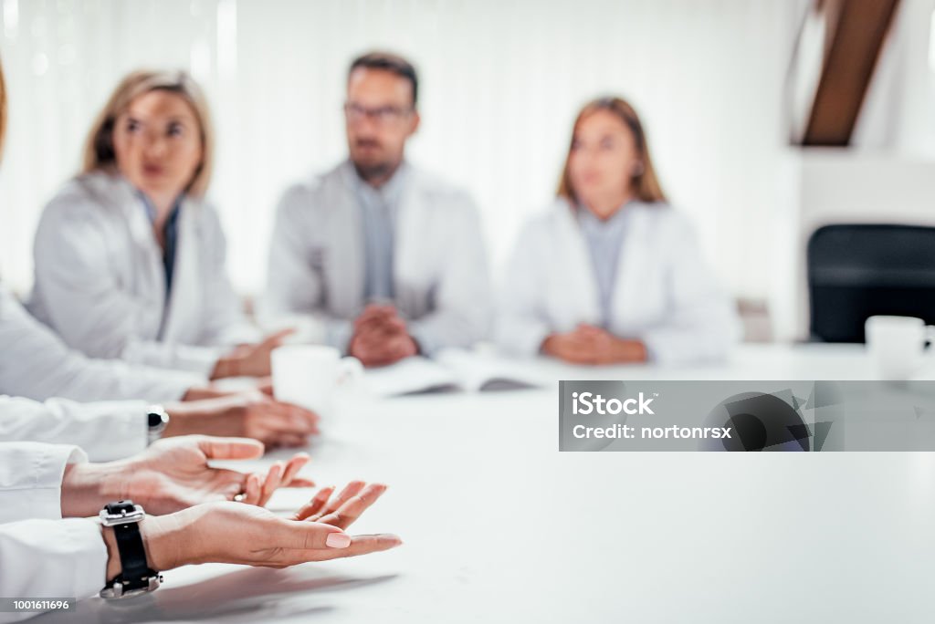 Medical staff discussing at the table. Copy space. Doctor Stock Photo