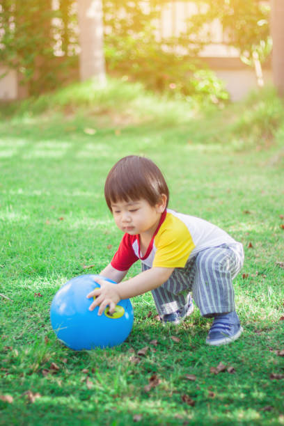 istock Happy young boy plays in the garden 1001615396