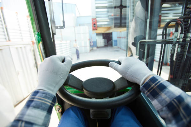 istock Truck driver at steering wheel 1001622370