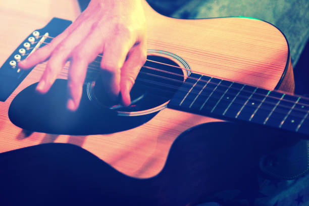 istock Playing acoustic guitar, close up on the hand 1001631368