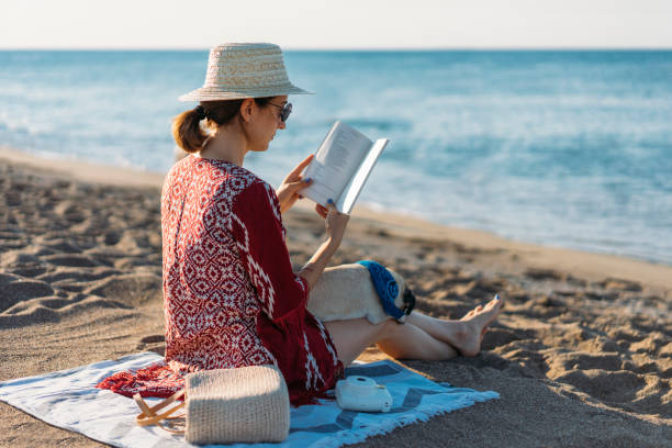 istock Young women enjoying vacation at the beach 1001639642