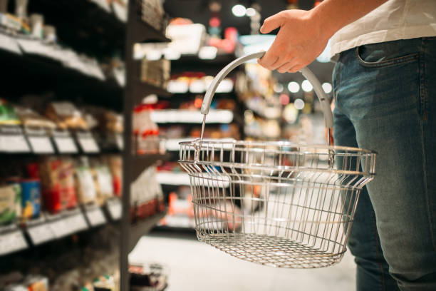 istock Male customer with empty basket in supermarket 1001644256