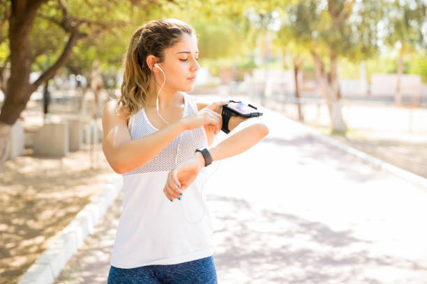 istock Woman playing some song on phone for workout 1001649558