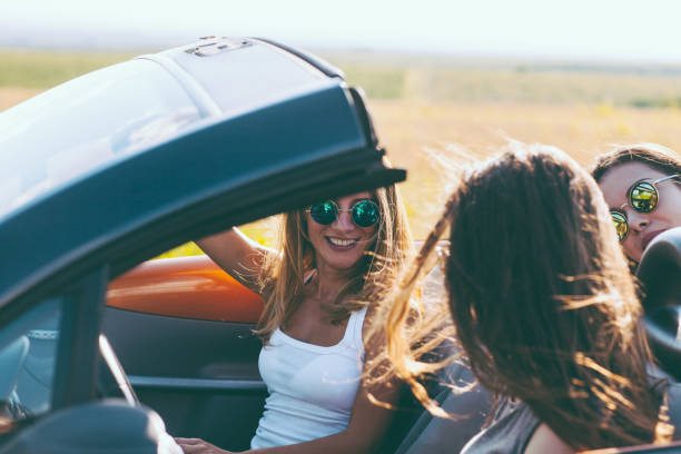 istock Young women on a road trip with cabriolet 1001652932
