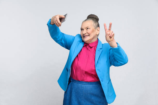 Older woman making selfie and toothy smiling