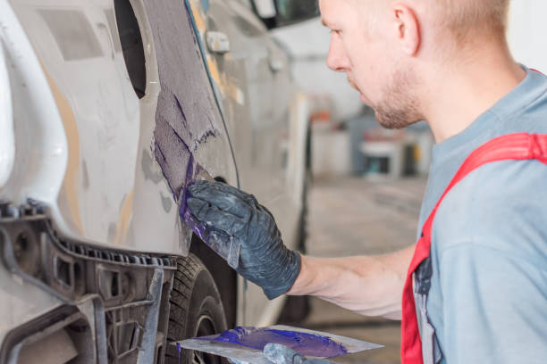 istock mechanic plastering car, car repair concept 1001657248