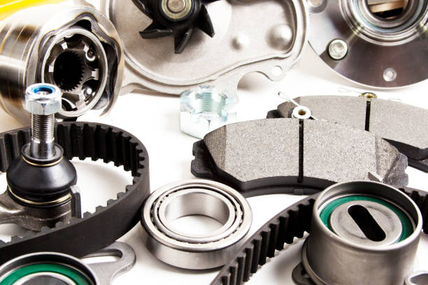 istock Auto parts background. Hub, pump, brake pads, filter, timing belt, rollers, constant velocity joints, thermostat and other on white background 1001660602