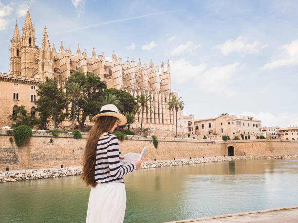 istock Stylish woman looking at the map 1001660740