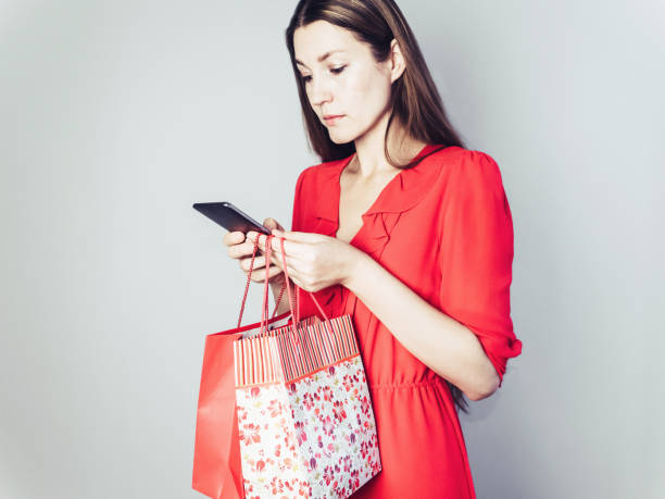 istock Happy woman in a red dress 1001665152