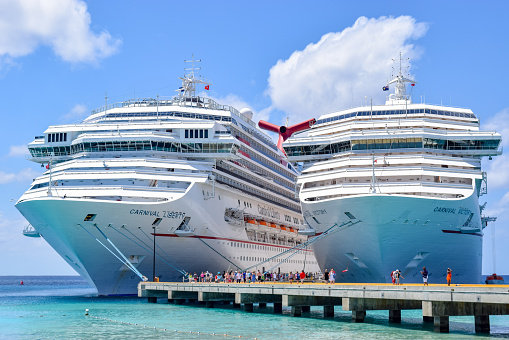 Grand Turk, Turks and Caicos Islands - April 03 2014: Carnival Liberty and Carnival Victory Cruise Ships moored side by side at the Grand Turk Cruise Terminal.