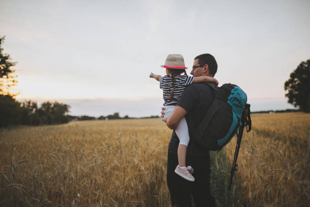 istock Child and her father having fun outdoors hiking 1001669026