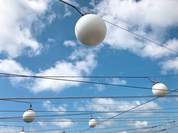 Lamps in front of a blue sky