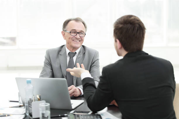 istock close up.business people talking at a Desk 1001676322