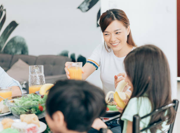 istock Smiling Modern mom serving a healthy meal 1001680218