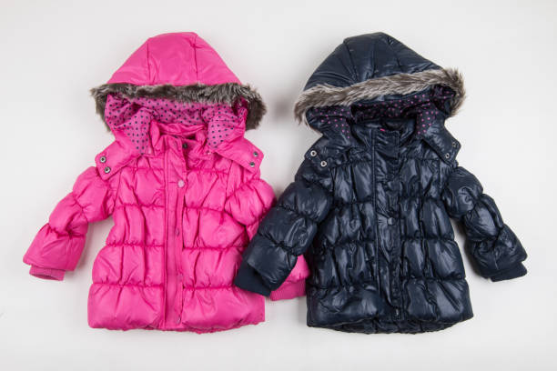 istock Two, cute blue and pink children's winter jackets 1001680246