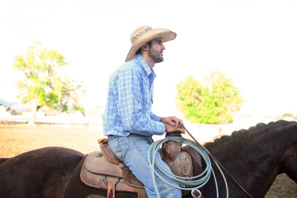 istock Young American Cowboy Rides Horseback While Working on Utah Ranch 1001683998
