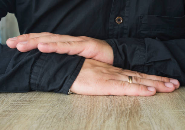 Mans hands on office desk. Close-up.