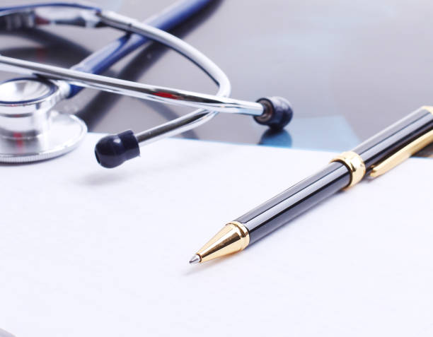istock stethoscope,x-ray and pen on the table 1001684180