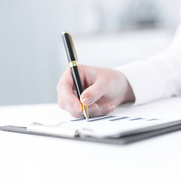 istock business woman analyzing the financial schedule 1001684518